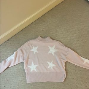 pink sweater with white stars